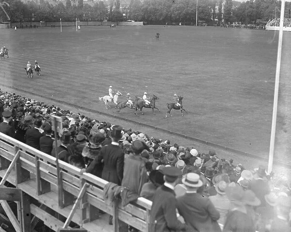 Polo at the Hurlingham Club. Spectators watching the play on the field. 19 May 1921