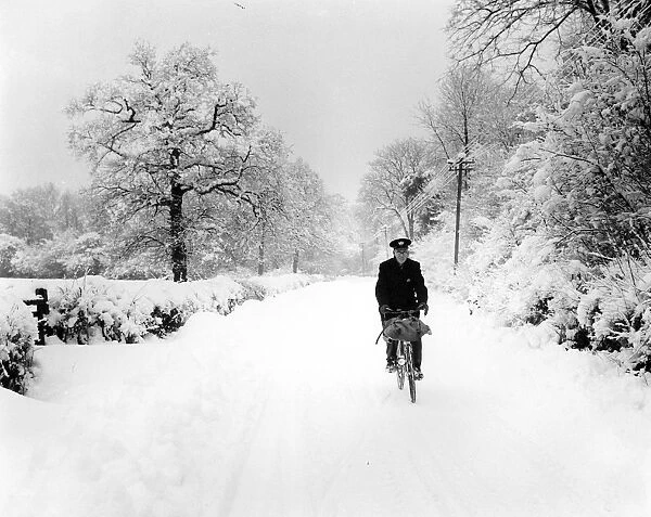 A postman trying to deliver in the heavy snow in Bough Beech, Kent. 28th December 1962