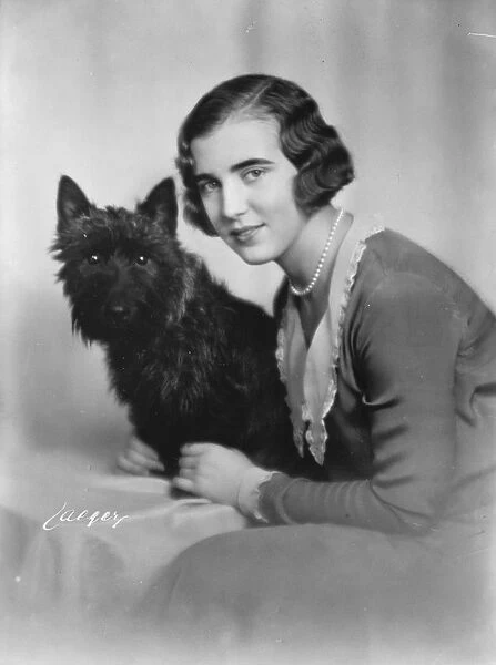 Princess Ingrid of Sweden with her pet dog. January 1930
