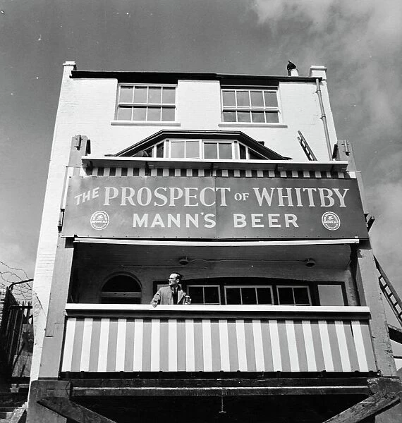 Pub and large sign for The Prospect of Whitby, Wapping, London, England 1951