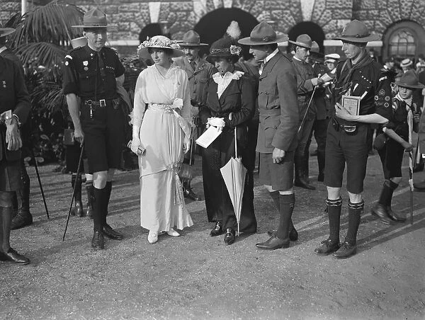 Queen Alexandra inspects the boy scouts at Horse Guard. Lady Baden Powell