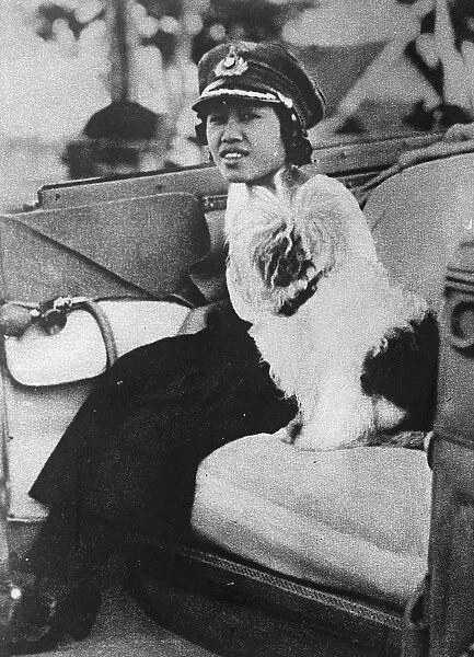 Queen as Colonel of the girl guides The Queen of Siam motoring to a rally of girl