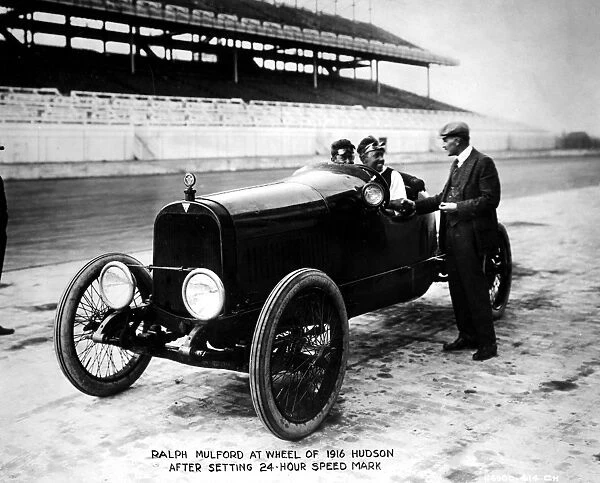 Ralph Mulford at wheel of 1916 Hudson after setting 24 hour speed mark
