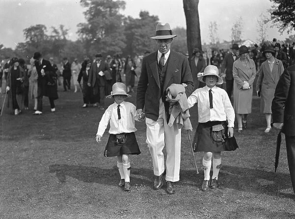 Ranelagh pony gymkhana. Wing commander Louis Greig with his little daughters Bridget