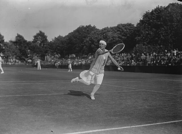 Reception to famous tennis stars at Roehampton club. Miss Bouman ( Holland ) in play