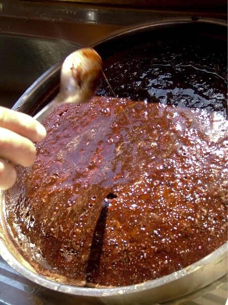 Rich sticky chocolate cake baked aboard Turkish gulet being dosed with chocolate
