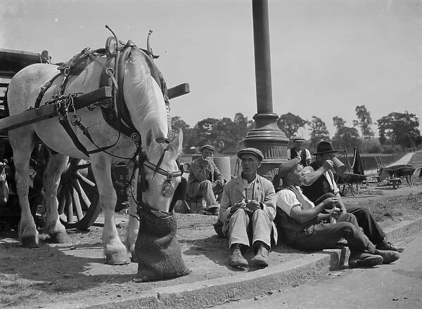 Road men taking tea in Eltham. 14 July 1937