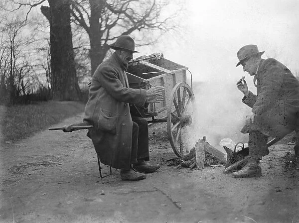 Road sweepers lunching round fire Chislehurst. 1935