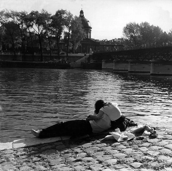 Romantic couple on the banks of the Seine, Paris in 1950s love couple romance romantic