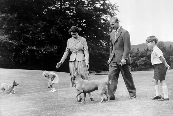 Royal family take a stroll in the grounds of Balmoral Castle. Princess Anne tempts