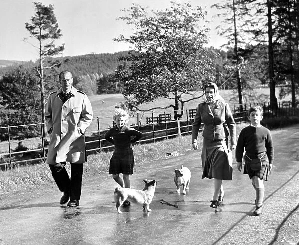 Royal family take a stroll. Queen Elizabeth, the Duke of Edinburgh and their two