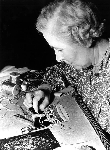 At the Royal School of Needlework in London, Miss R Essam works on the minute detail