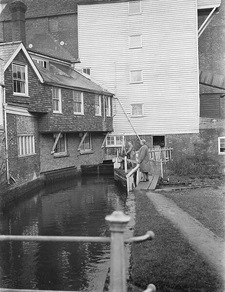 S O Garnham at the water powered, flour East Hill Mill in Ashford, Kent, which
