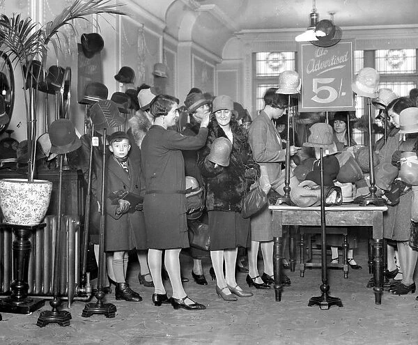 Sales time in Kensington. Scene at Barker s. 28 December 1928