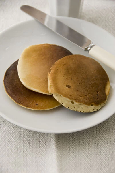 Three Scotch pancakes on a white plate credit: Marie-Louise Avery  /  thePictureKitchen