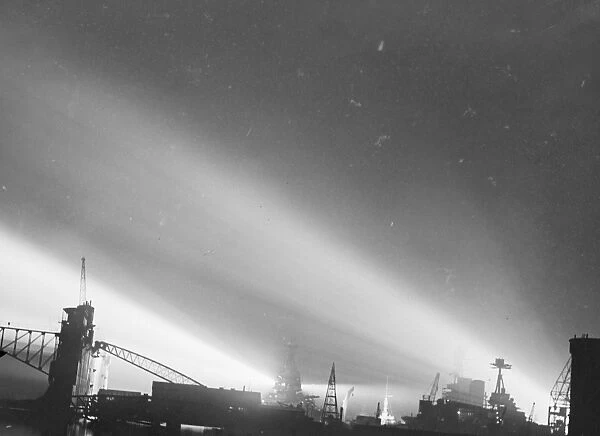 Searchlight display in honour of Royal wedding at Portsmouth. Searchlights playing over Repulse