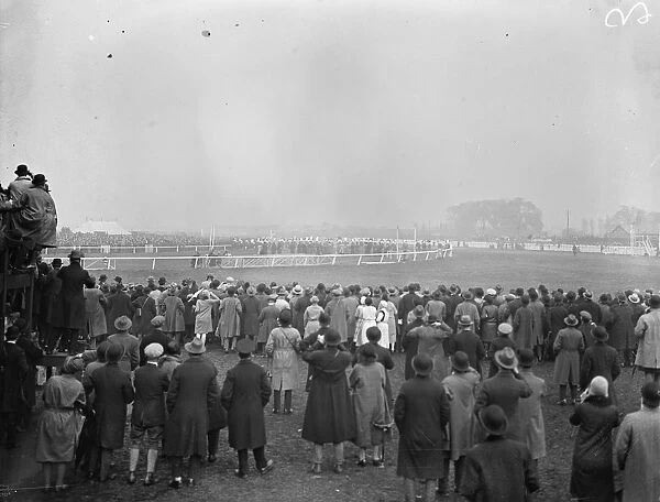Sensational Grand National. Spectators looking in the mist at the start. 30 March
