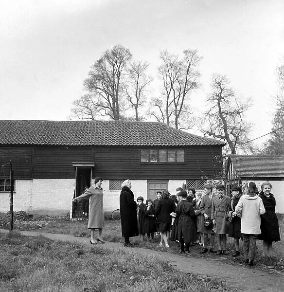 Sidcup, Kent; These children lined up outside an old barn in Sidcup, Kent are
