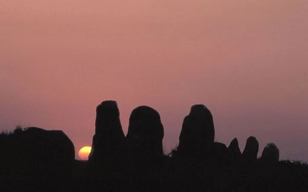 Silhouette of the Carnac landscape: alignments of menhirs at sunrise, Morbihan, Southern Brittany