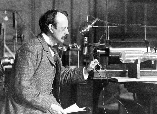 Sir J. J. Thomson with early equipment in the Cavendish Laboratory, Cambridge