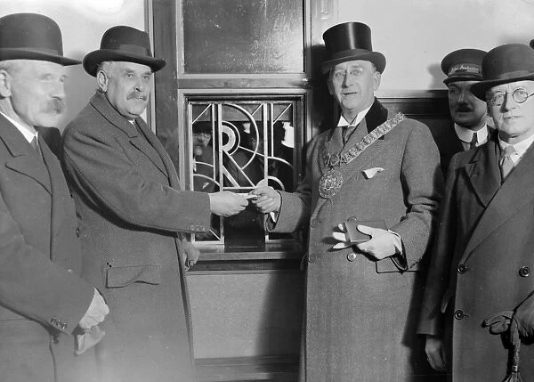 Sir Josiah Stamp, 2nd from left, handing the first ticket issued at the New London Midland