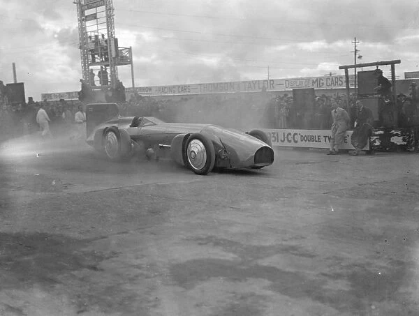 Sir Malcolm Campbell damages tyres on Brooklands concrete track. The Bluebird out