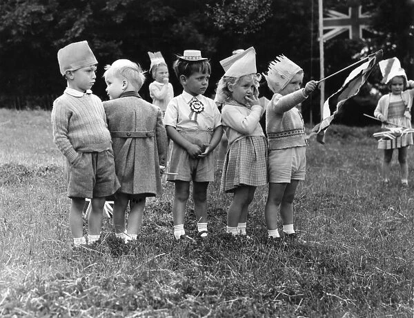 Small children bewildered by it all during the Coronation celebrations at Bexley