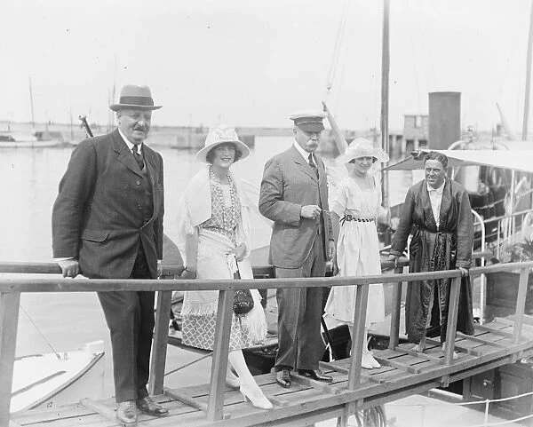 Society at Deauville. Sir Francis Lloyd with friends on the gangway of Captain