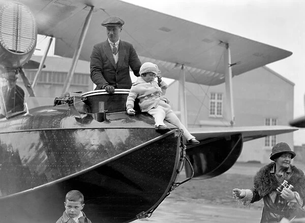 Squadron Leader Archibald Stuart MacLaren and his daughter standing in the Vickers