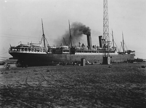 SS Minnesota taking oil fuel in Port Said. Troops on board for China. 3 February 1927