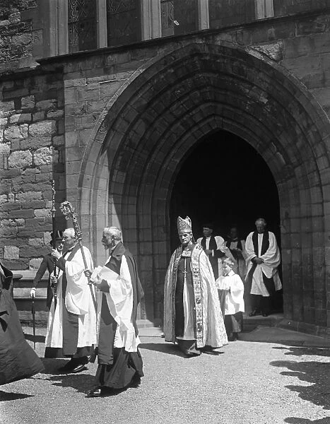 At St Asaph, Wales. Dr Edwards, first Archbishop of Wales leaving the cathedral