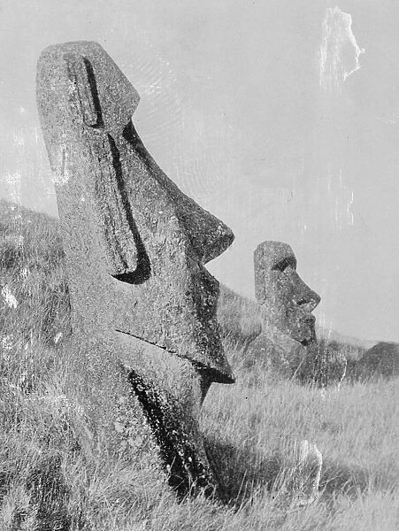 Two Statues of monolithic human figures carved from rock on the island of Easter