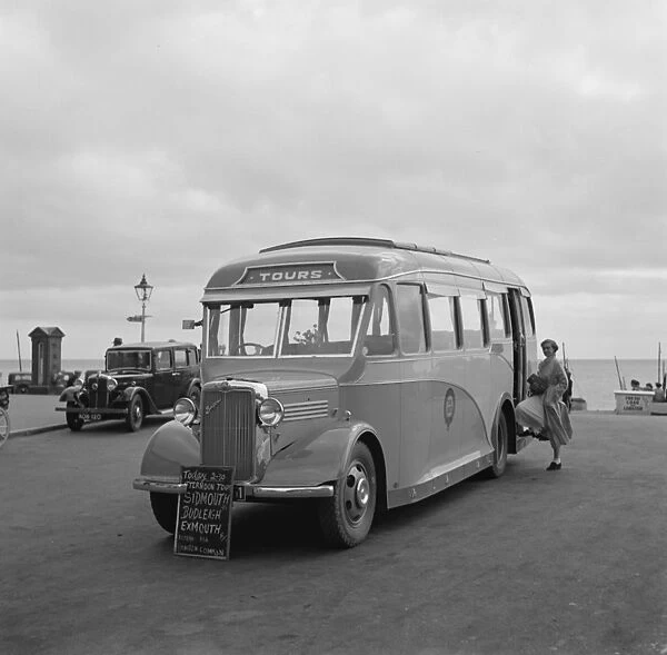 Swanage tour coache on the sea front in Swanage, Dorset. 1936