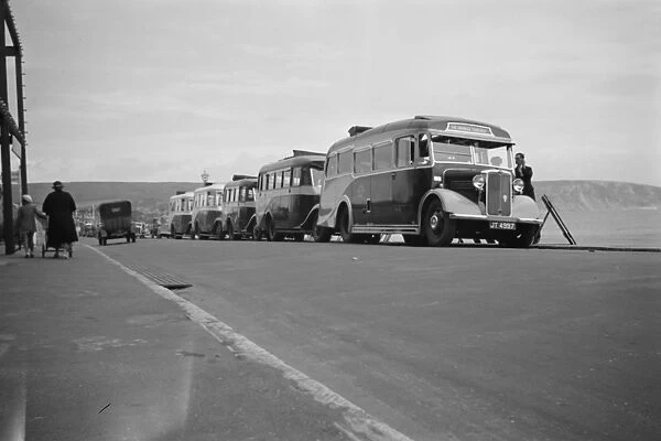 Swanage tour coaches on the sea front in Swanage, Dorset. 1936