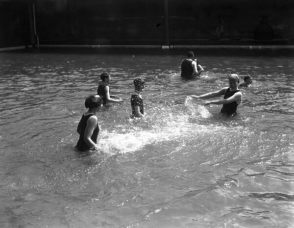 Swimmers in the open air swimming pool at Westcliff - on - Sea, Essex
