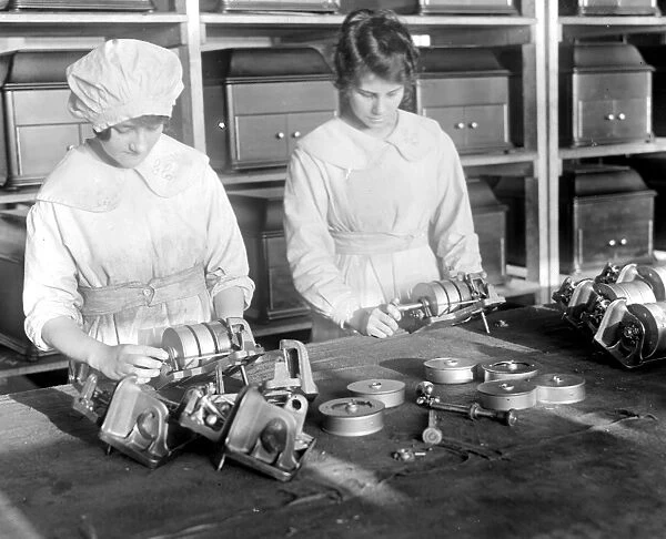 Taken at the Gramophone Works at Hayes. Assembling the mechanism which drives the turntable