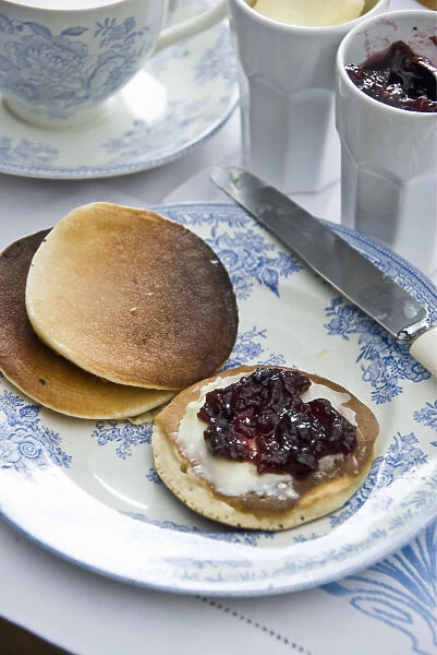 Teatime setting with scotch pancakes and raspberry jam credit: Marie-Louise Avery