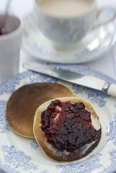 Teatime setting with scotch pancakes and raspberry jam credit: Marie-Louise Avery
