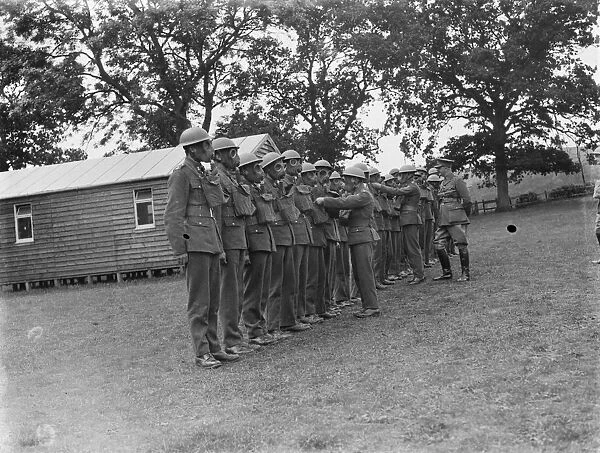 Territorial Army recruits at camp in Chichester, Sussex. Gas masks and uniform inspection