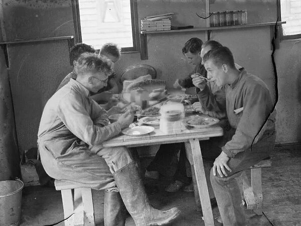 Territorial Army recruits at camp in Chichester, Sussex. Dinner is served. 1939