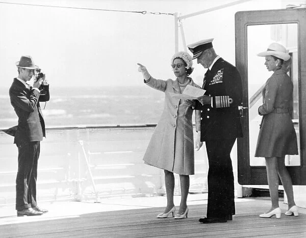 Torbay, Devon : An informally clad Prince Of Wales takes a photograph of his mother