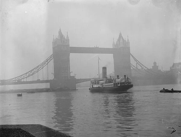 Towering above the Golden Eagle. The Golden Eagle passing under Tower Bridge with