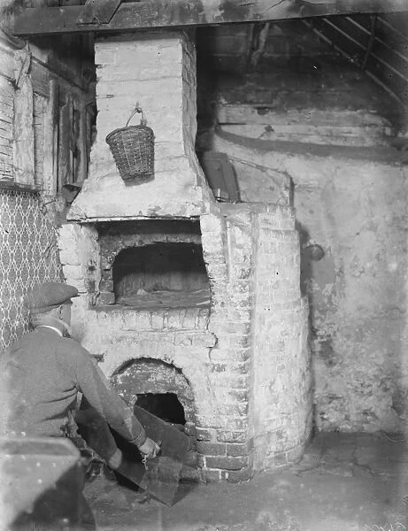 A tudor fire place in a building in Swanley, Kent. 1936