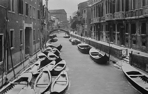 An unusal sight in Venice - gondolas stuck in ice along a canal. 20 February 1929