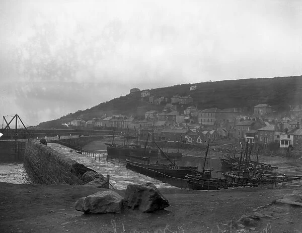 A view of Mousehole Harbour and town. 27 March 1929