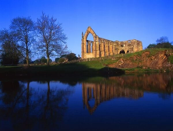 View of the ruins of Bolton Abbey across the river