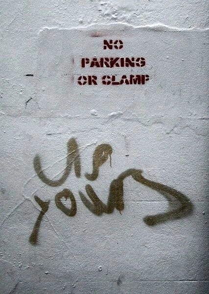 Vulgar graffiti in response to public notice: no parking or clamp