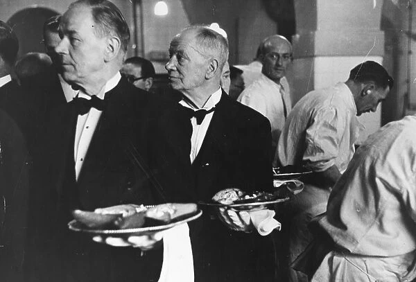 Waiters collect orders in the kitchen for the first course of a state banquet, Avocado Pears