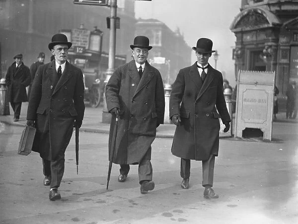 As they walk to the Houses of Parliament, Mr Arthur Henderson, MP, the Home Secretary