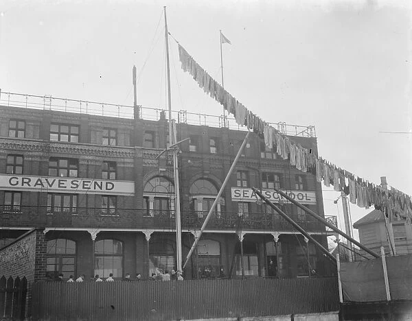 Washing is hanging from the mast at Gravesend Sea School in Kent. 1939